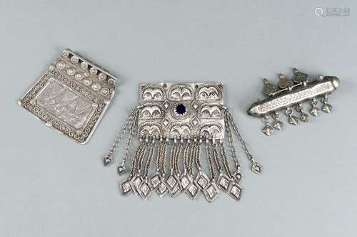 A GROUP OF THREE SILVER AND METAL PENDANTS, c. 1900s