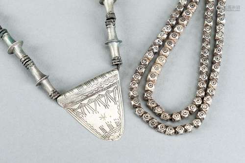 TWO MIDDLE EASTERN SILVER AND METAL NECKLACES, c. 1900s