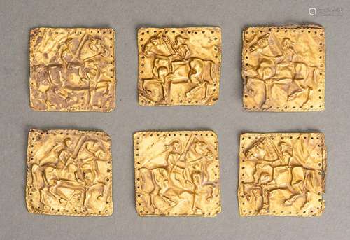 A GROUP OF SIX ACHAEMENID GOLD PLAQUES WITH WARRIORS ON HORS...