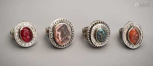 A LOT WITH FOUR SILVER RINGS SET WITH SASANIAN HARDSTONE INT...