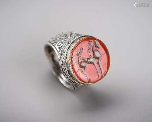 A SASANIAN CARNELIAN INTAGLIO INSET SILVER RING