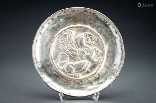 A PERSIAN SILVER REPOUSSÉ ‘WINGED GRIFFIN’ DISH