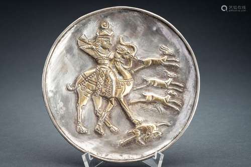 A PERSIAN PARCEL-GILT SILVER REPOUSSÉ ‘HUNTER’ DISH