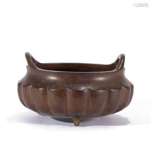 A BRONZE TRIPOD CENSER