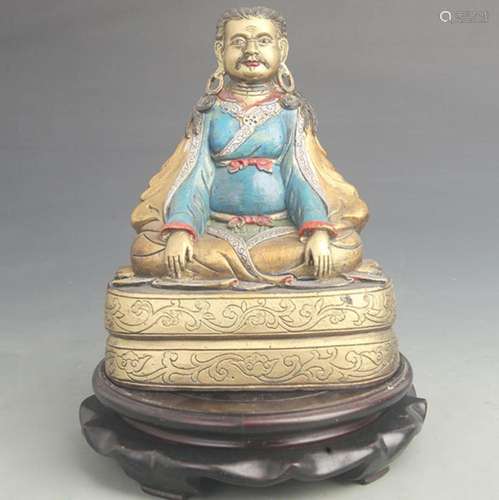 A COLORED BRONZE STATUE IN MARPA FIGURE