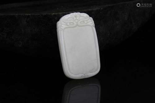 A FINE HE TIAN PALE CELADON JADE PENDANT PLAQUE