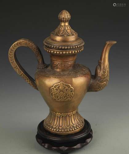 A FINE TIBETAN BUDDHIST FINELY CARVED BRONZE EWER