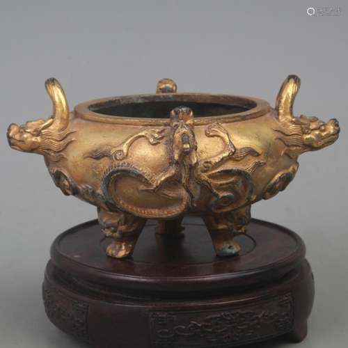 A GILT BRONZE THREE LEGGED INCENSE BURNER