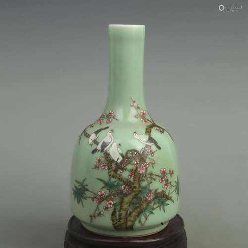 A GREEN GLAZED LUCKY MAGPIE PATTERN BELL SHAPED BOTTLE