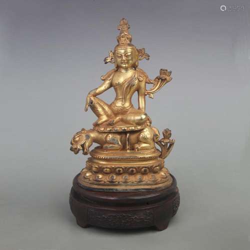 A BINE GILT BRONZE GREEN TARA RIDING A BEAST STATUE