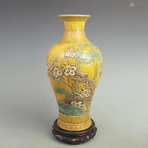 A FINE YELLOW GROUND PLUM TREE CARVING PORCELAIN VASE