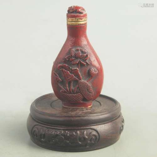 A FINE RED CARVED LACQUER FLOWER PATTERN SNUFF BOTTLE