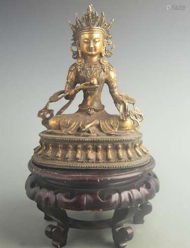 A FINE GILT BRONZE THREE TREASURES BUDDHA