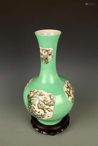 A GREEN GROUND FLOWER PATTERN LONG NECK VASE