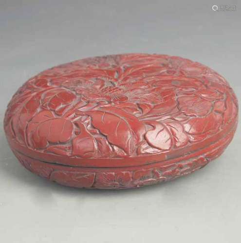 A FINE RED CARVED LACQUER FLOWER PATTERN BOX