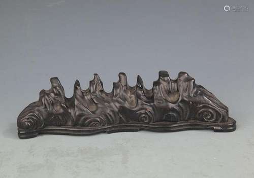 A SANDALWOOD MOUNTAIN FIGURE BRUSH RACK