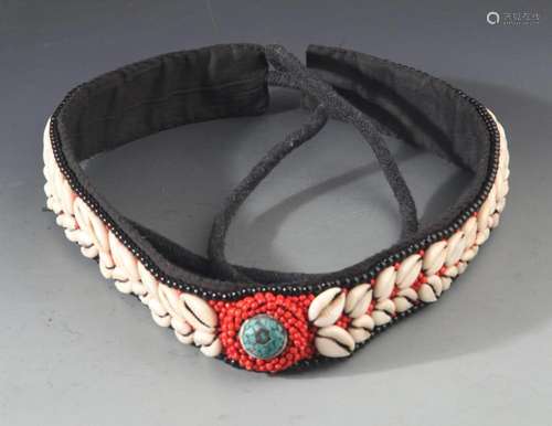 A FINE CORAL WITH SEA SHEEL HEADBAND