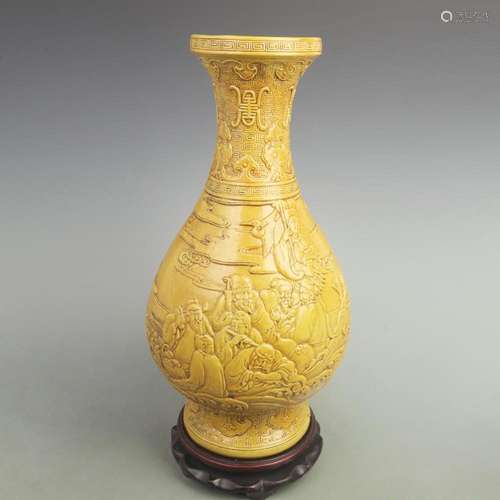 A FINE YELLOW GROUND CARVED EIGHT IMMORTALS FIGURE PORCELAIN...