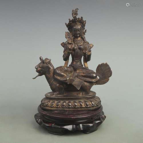 A FINE GILT BRONZE GUARDIAN DEITY WITH RIDING BULL FIGURE