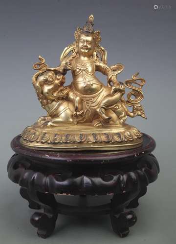 A FINE GILT BRONZE HAI BAO TIAN WANG BUDDHA STATUE