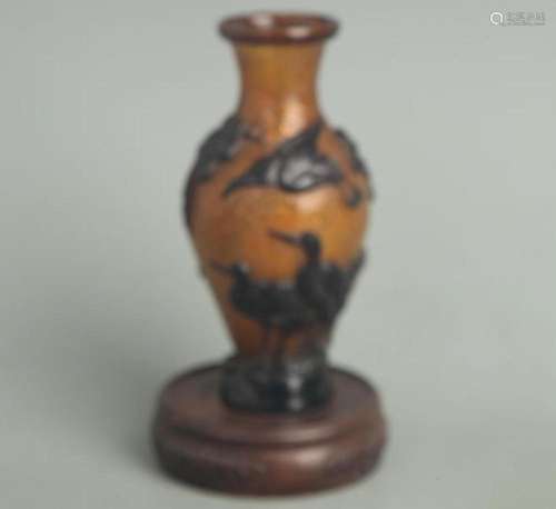 A FINE AMBER COLOR CRANE FIGURE GLASS BOTTLE