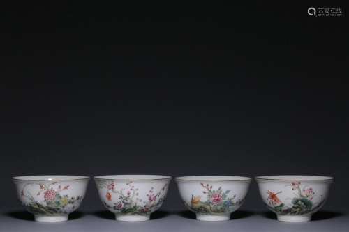 A set of four enamel colored flower, bird and insect cups