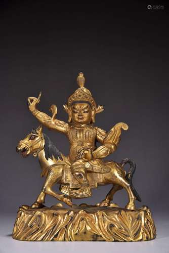 A gilt bronze statue of a god riding a horse