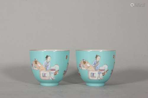 A pair of turquoise green glaze pastel character story cups