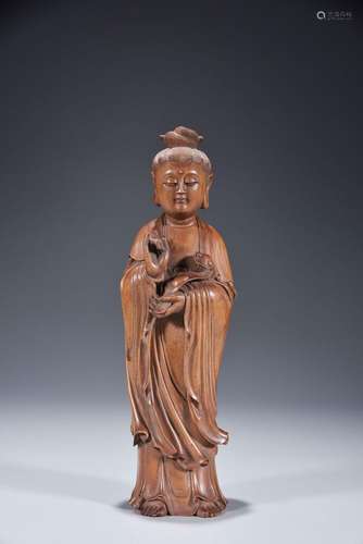 Standing statue of Ruyi Guanyin carved in sandalwood