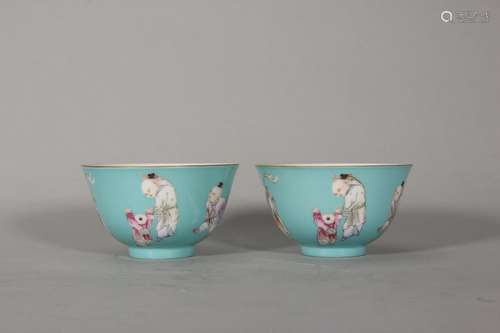 A pair of turquoise glaze famille rose figure porcelain cups...