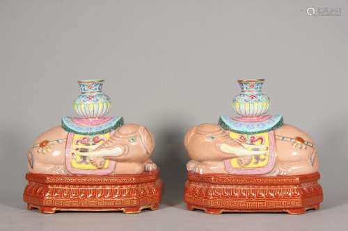 A pair of famille rose porcelain elephant incense stick hold...