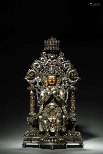 A silver Maitreya statue