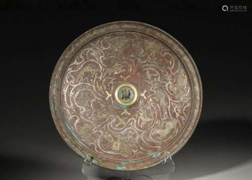 A gold and silver-inlaid bronze mirror,Han Dynasty,China