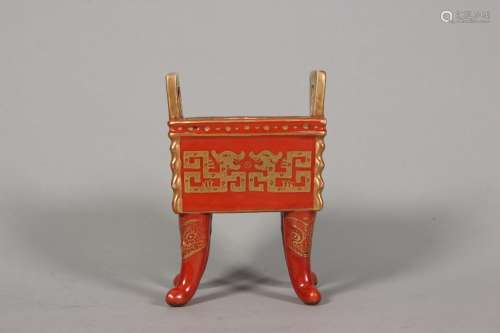 An iron red ground gilt kui dragon patterned porcelain cense...