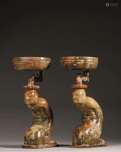 A pair of jade kneeling figurine candlesticks,Han Dynasty,Ch...
