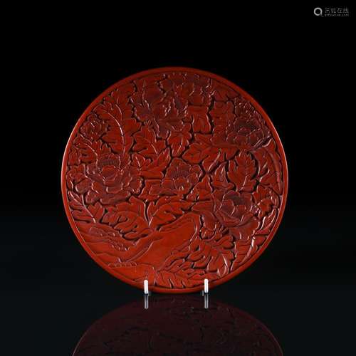 A Chinese lacquered 'Peony' plate