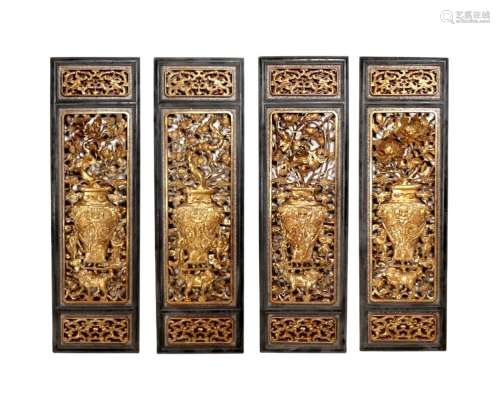 A set of four hanging screens with woodcarving and lacquered...