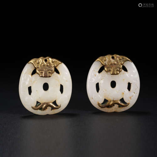 A Pair of Hetian Jade Wrapped with Gold and Animal Patterns,...