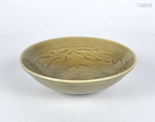 A Chinese Yue celadon bowl with carved floral pattern, possi...