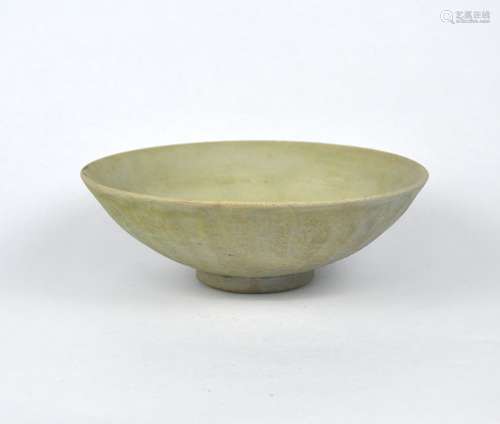 An early Chinese celadon bowl decorated with flower petal ar...