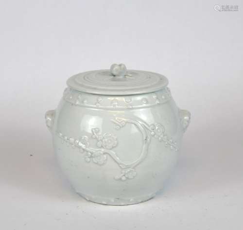A Chinese Dehua white glazed drum shaped covered jar, 19th C...