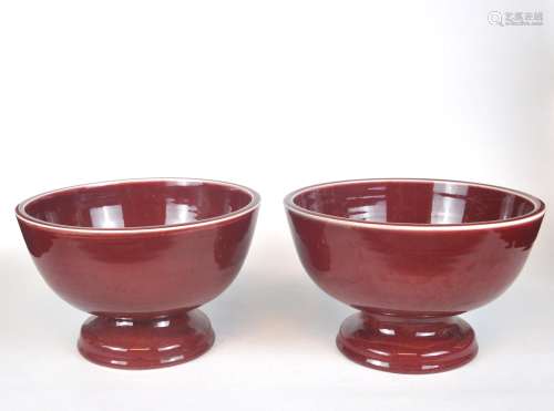 A pair of Chinese ox blood glazed stem bowls, 20th C.