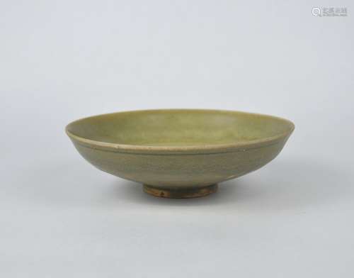 A Chinese Yaozhou celadon shallow bowl decorated with ring, ...