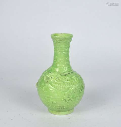 A small Chinese apple green glazed vase decorated with relie...