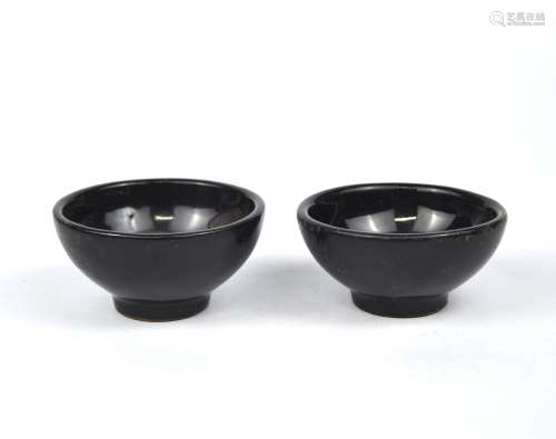 A pair of Chinese black glazed tea bowls,