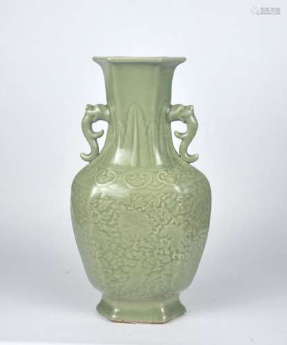 A Chinese celadon vase with molded floral pattern, Qing Dyna...