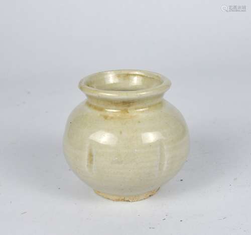 An early Chinese yellowish white glazed jar, possibly Tang d...