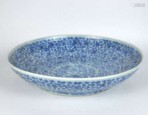 A large Chinese blue & white charger, late Ming or early Qin...