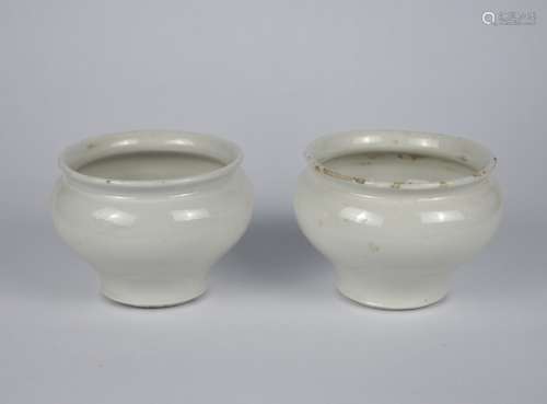 A pair of early Chinese white glaze jars, Yuan dynasty