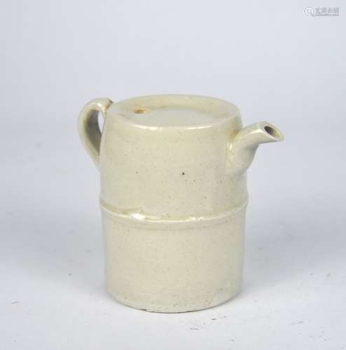 A small early Chinese yellowish white glaze scholar's water ...